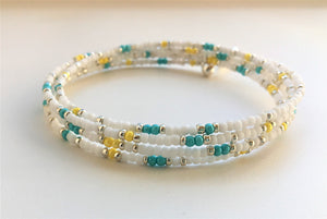 Beaded memory wire bracelet - white, turquoise, yellow and silver beads with angel wing pendant - eDgE dEsiGn London