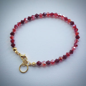 Stylish Swarovski crystal bracelet - shades of red with gold plated adjustable clasp - eDgE dEsiGn London