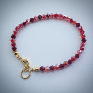 Stylish Swarovski crystal bracelet - shades of red with gold plated adjustable clasp - eDgE dEsiGn London