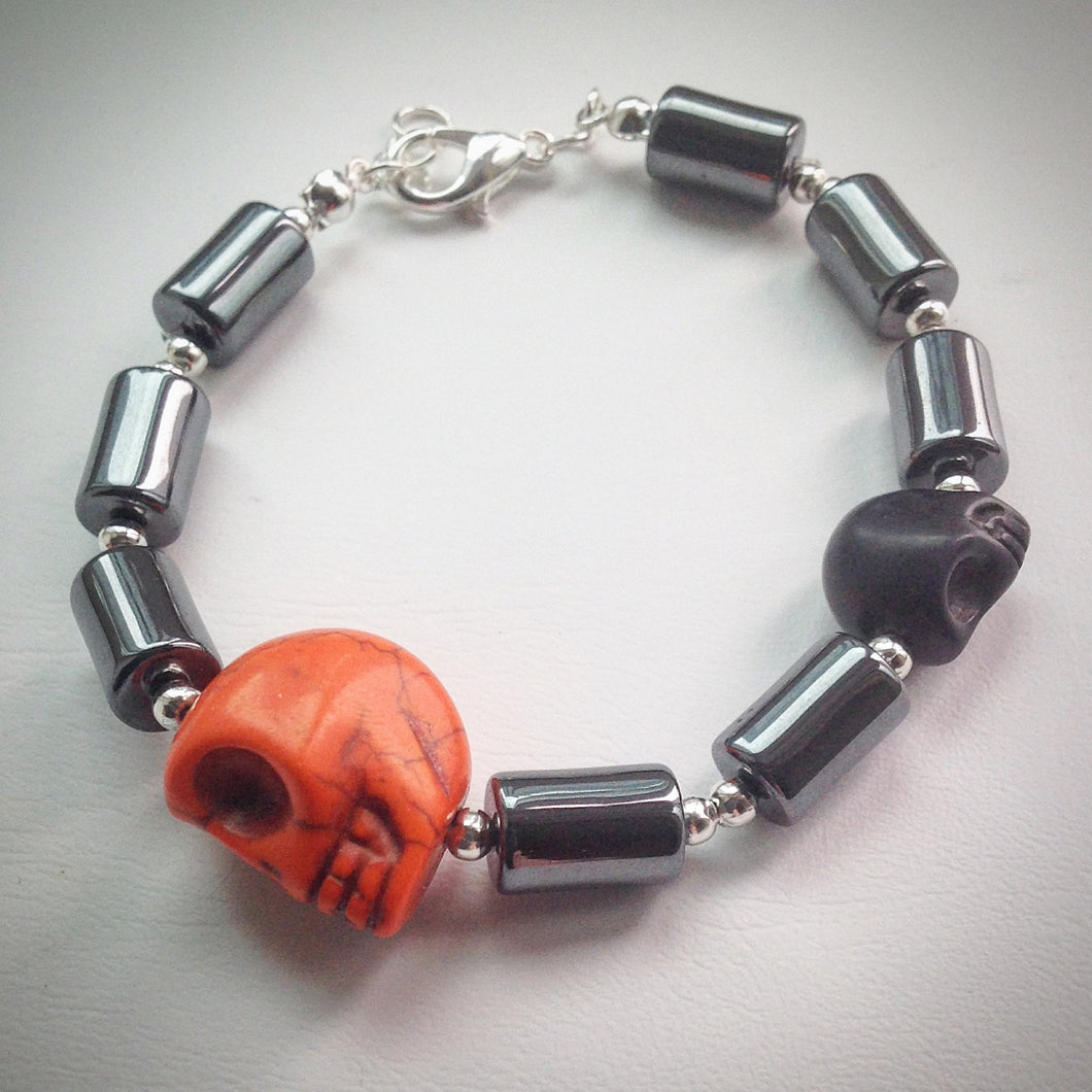 Beaded bracelet - Hematite and silver with orange and black skulls - eDgE dEsiGn London