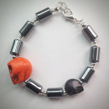 Beaded bracelet - Hematite and silver with orange and black skulls - eDgE dEsiGn London
