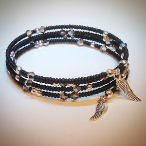 Beaded memory wire bracelet - black with silver and Swarovski crystals and wing pendants - eDgE dEsiGn London