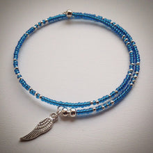Beaded memory wire bracelet - blue glass and silver seed beads, silver plated wing pendant - eDgE dEsiGn London